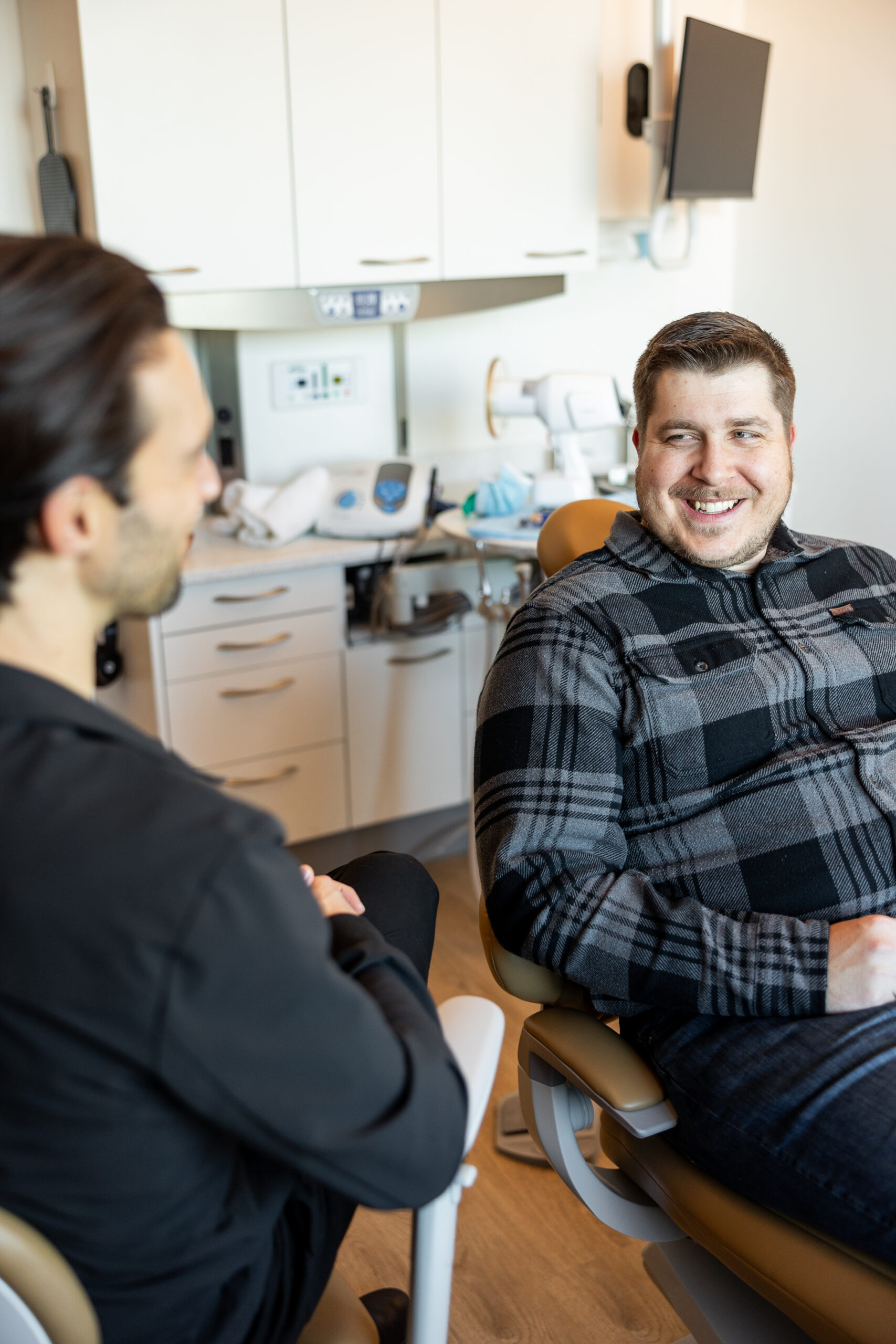 Dr. Clayton shaking hands with a patient